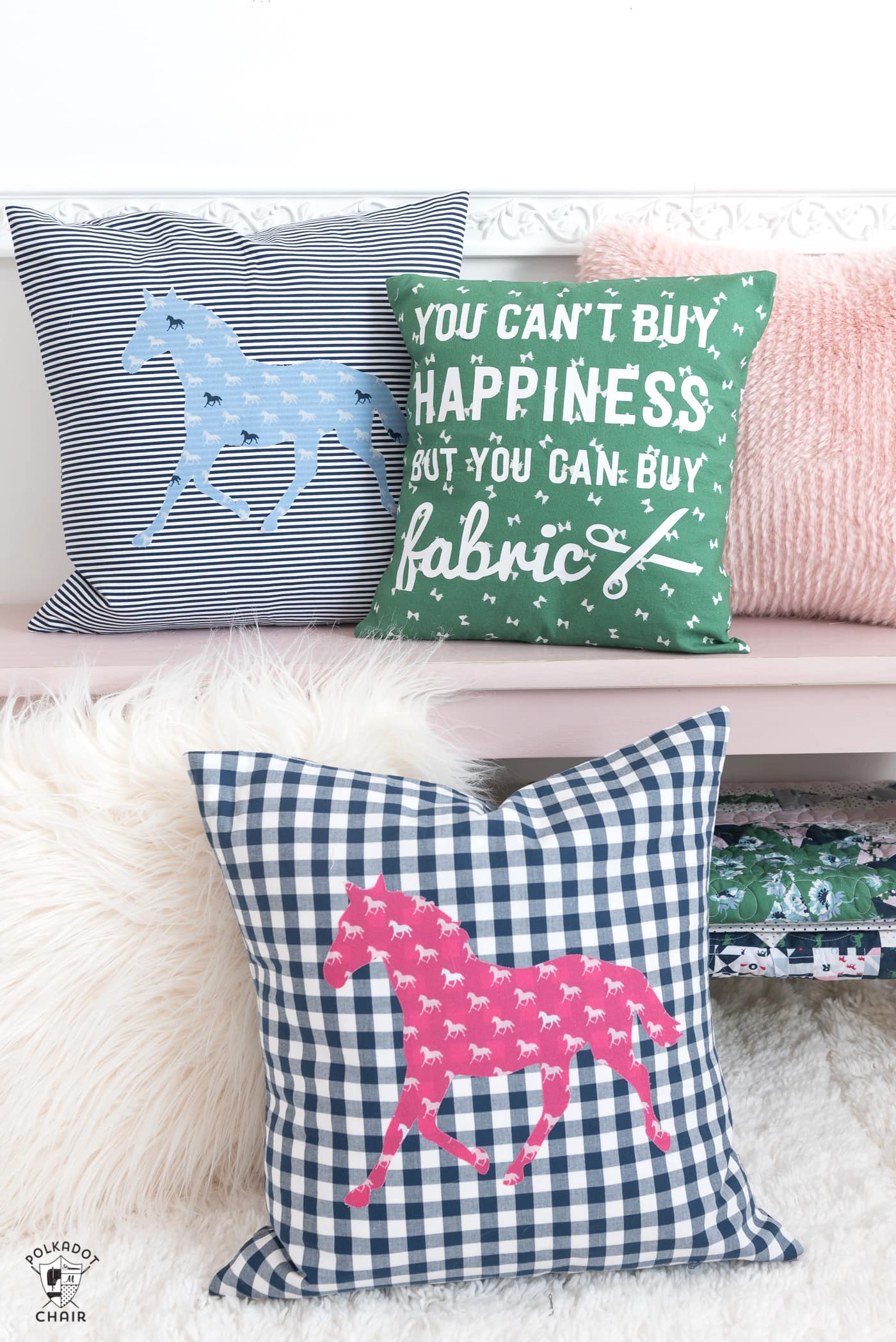Handmade horse themed pillows on pink bench.