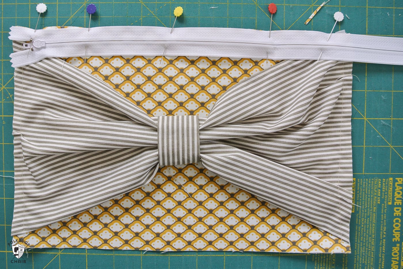 Big Bow Clutch; A DIY clutch purse pattern and free sewing tutorial. How to make an easy fabric clutch with a bow on the front. Fun sewing gift ideas.