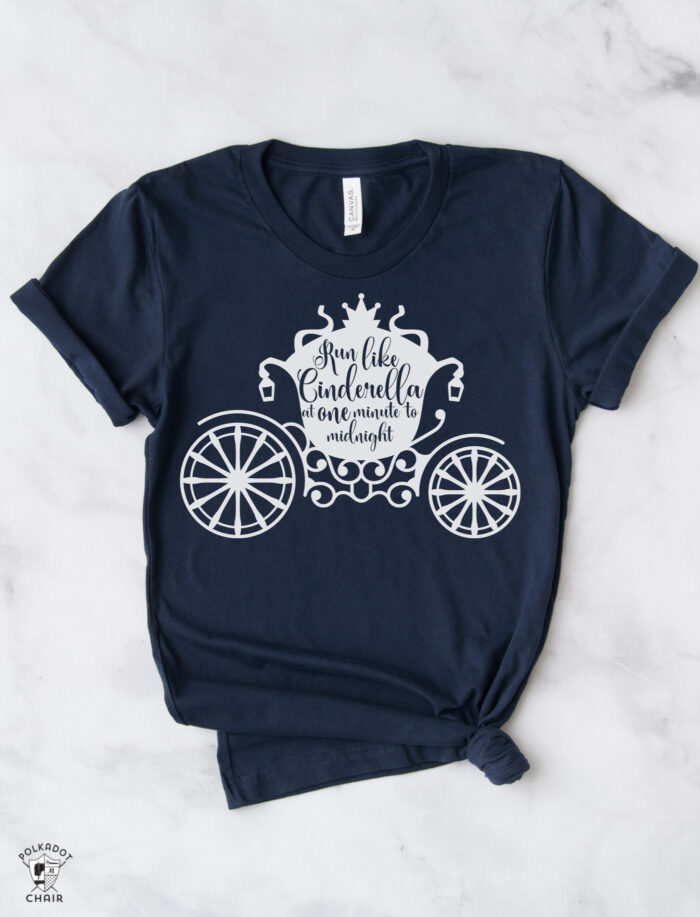 white cinderella carriage on navy tee