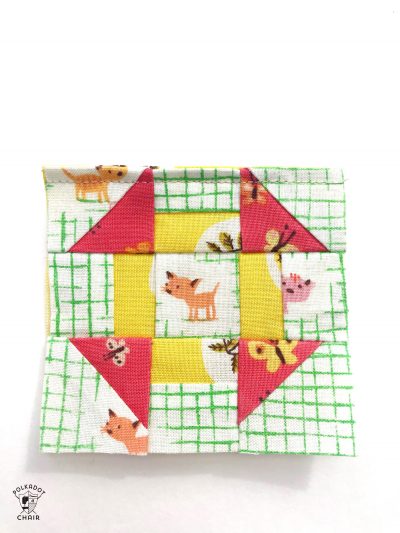 mini churn dash quilt block for pincushion