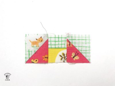 constructing the mini churn dash quilt block