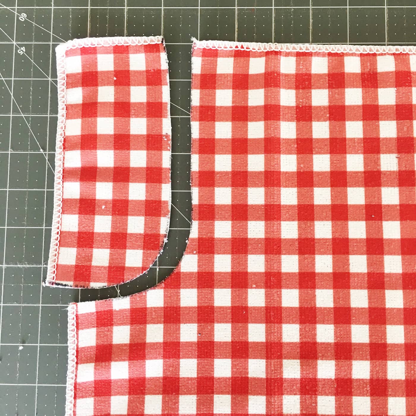cutting out the towels to make apron