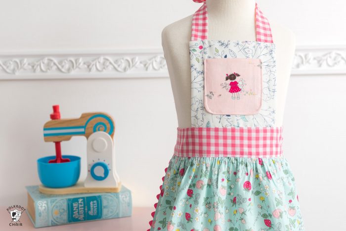 child's apron on dress form