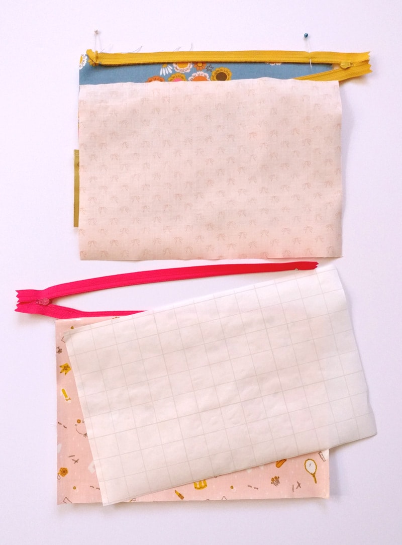 fabric for makeup bag with plastic lining on white tabletop