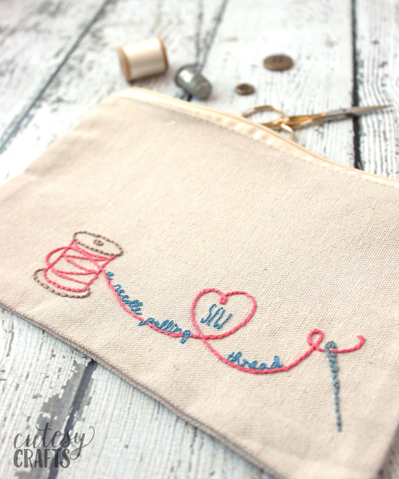 Hand embroidered zip bag on white tabletop