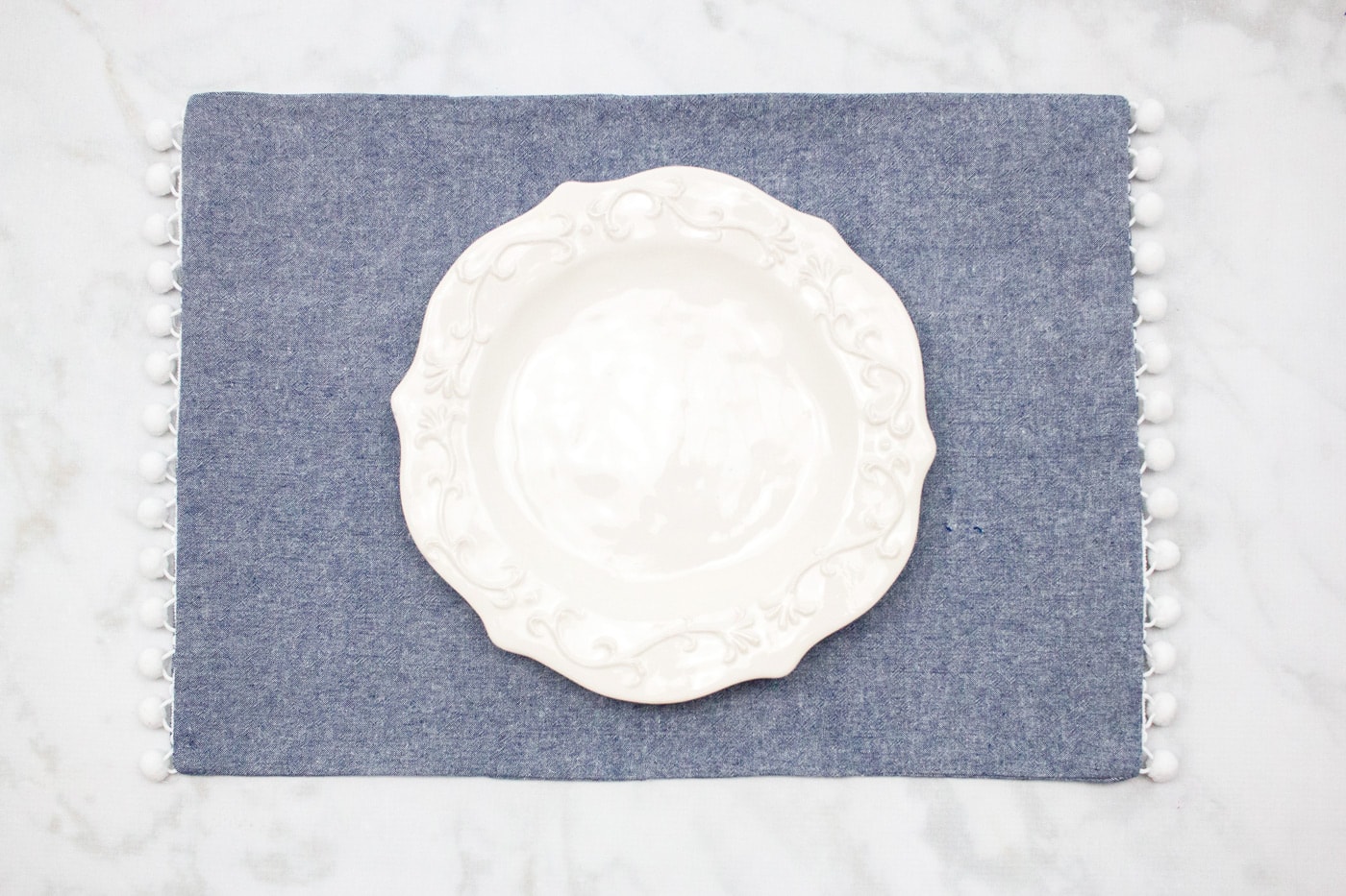 chambray placemat on marble table