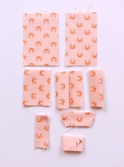 fabric for makeup bag with plastic lining on white tabletop