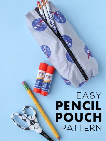 pencil pouch with glue stick and pencil on blue background