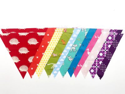 rainbow flag bunting on white tabletop