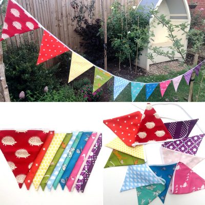 rainbow flag bunting on white tabletop