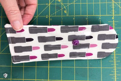 lip gloss case pieces on green cutting mat