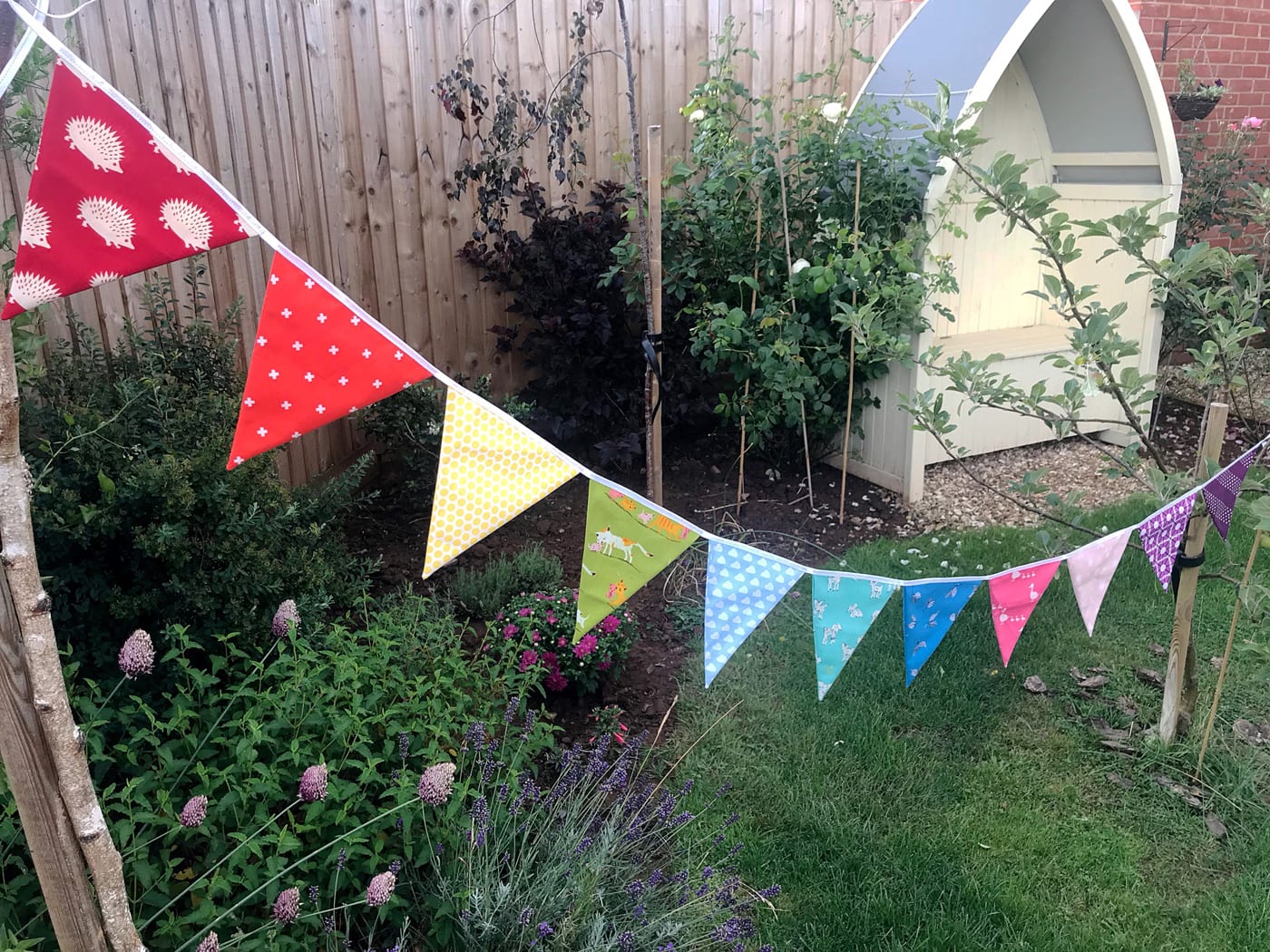 rainbow flag bunting on white tabletop