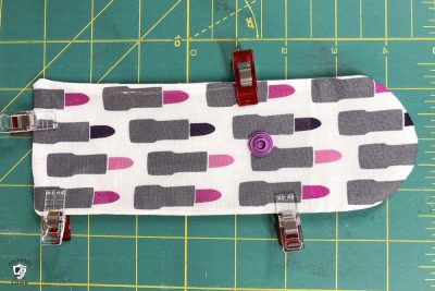 lip gloss case pieces on green cutting mat