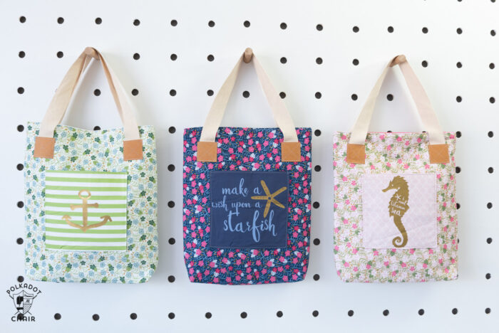Tote bags on white peg board