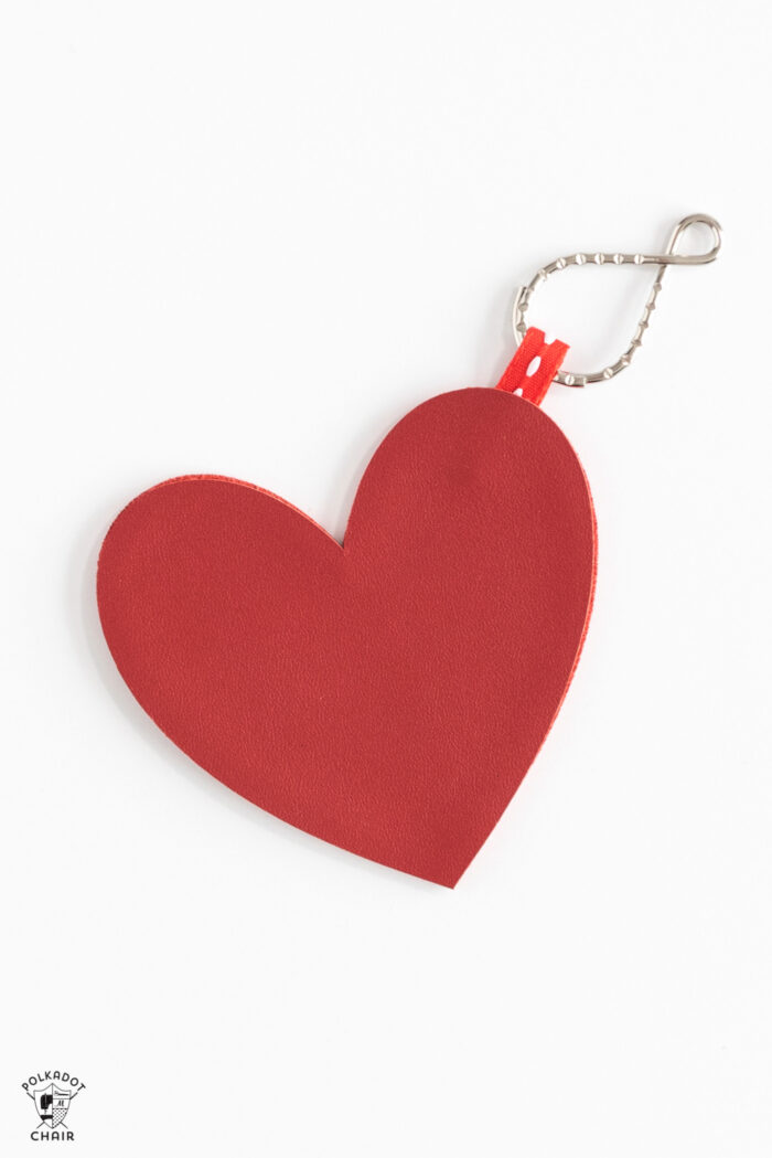 leather conversation hearts on white table