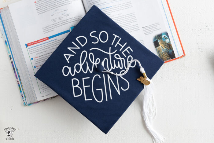 Decorated Graduation Caps on white table