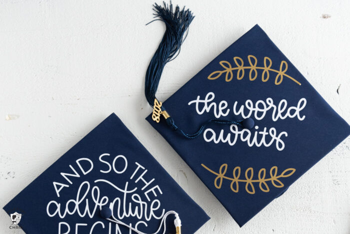 Decorated Graduation Caps on white table