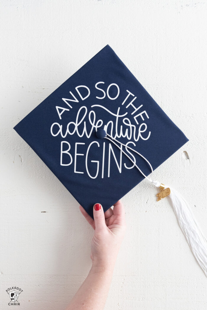 Decorated Graduation Caps on white table