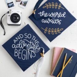 Decorated Graduation Caps on white table