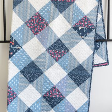 Gingham quilt pattern on white wall