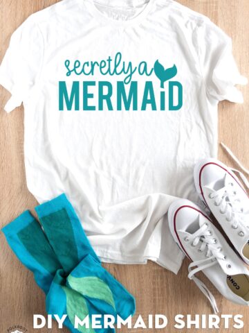 secretly a mermaid shirt on table