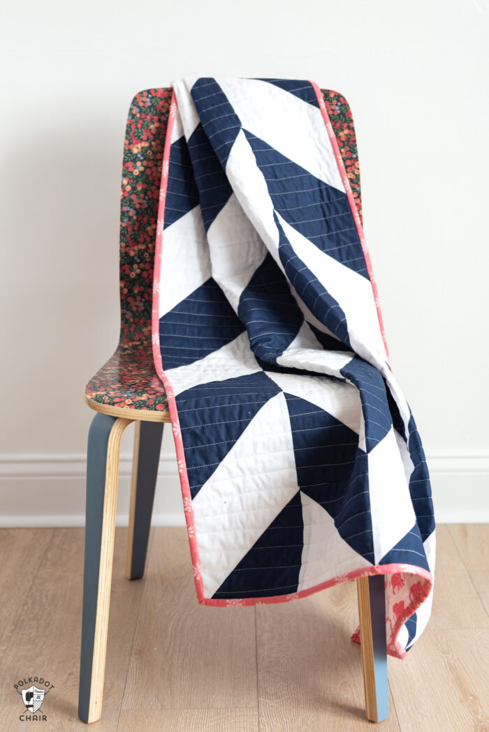 navy and white herringbone quilt on chair