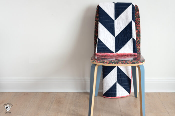 navy and white herringbone quilt on chair