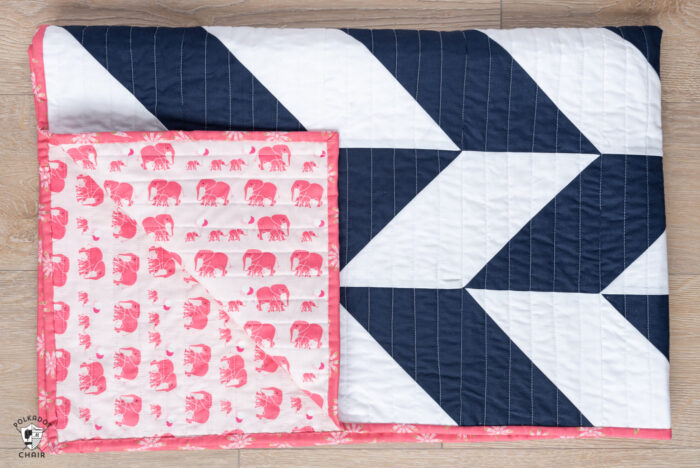 navy and white herringbone quilt with pink backing