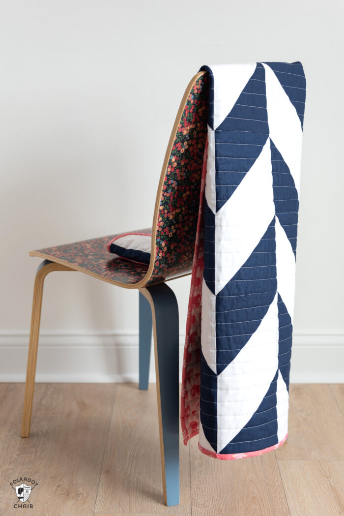 navy and white herringbone quilt on chair