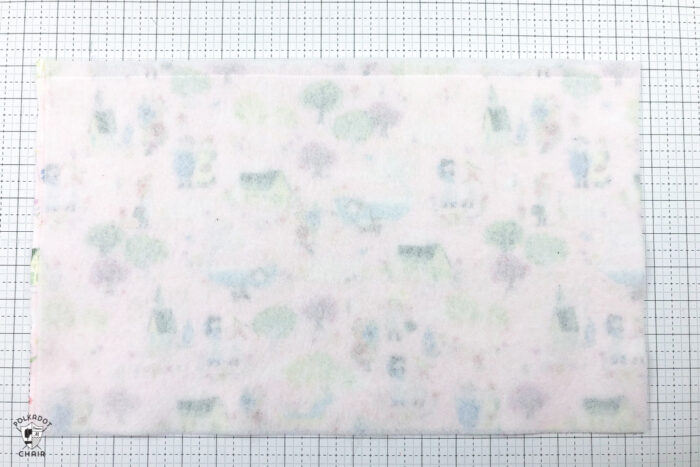 Reading pillow construction steps on white cutting mat