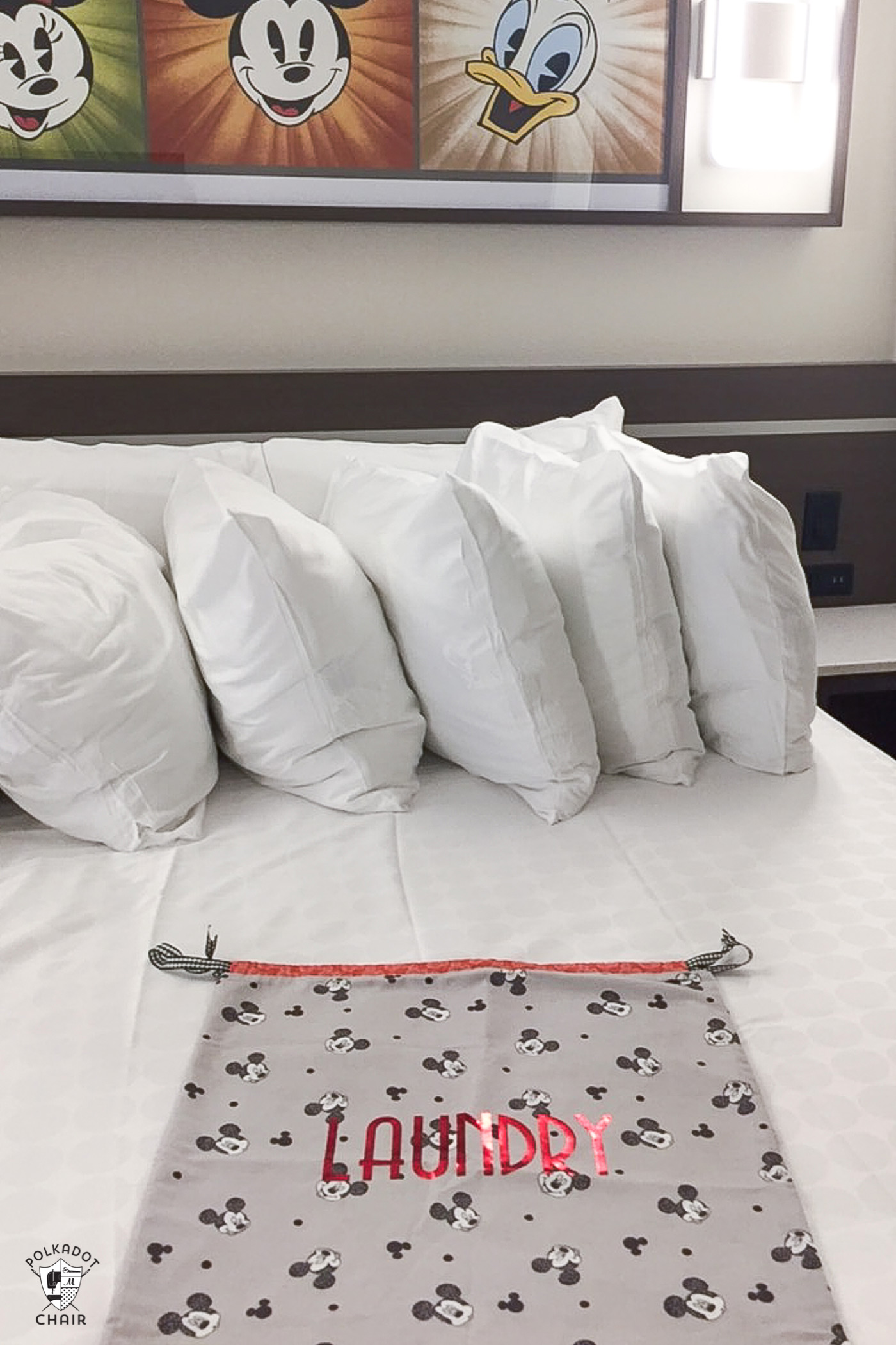 Disney themed laundry bag on white bed