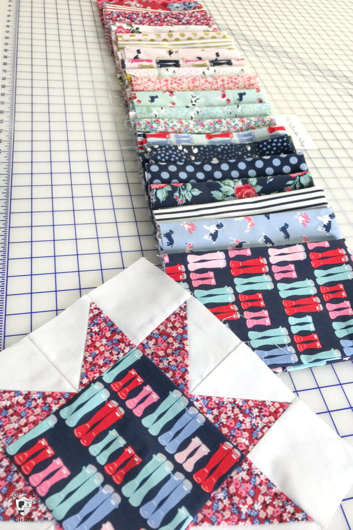 stacks of colorful fabric folded on white cutting table