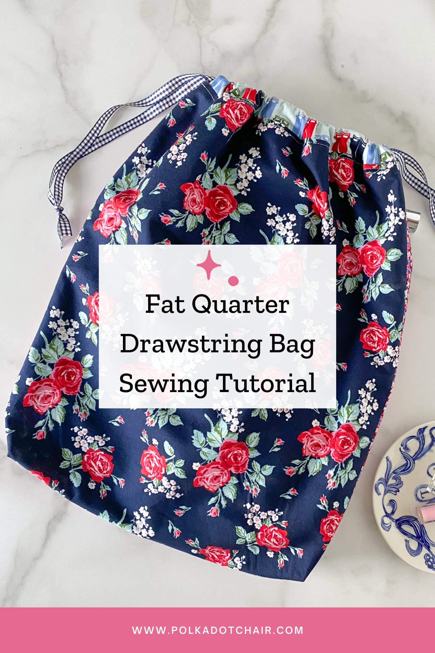 navy floral lined drawstring bag on white table