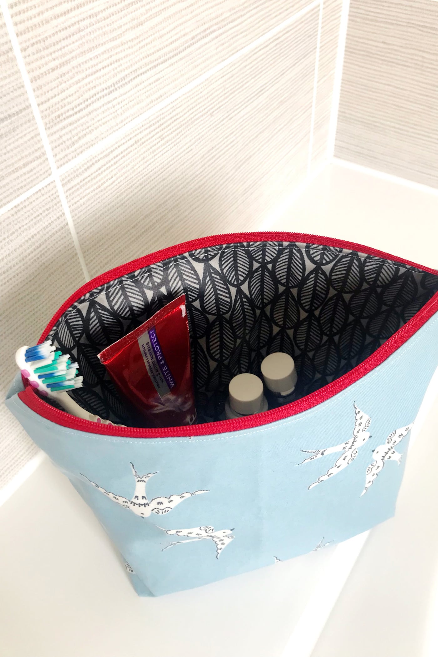 Inside of the laminated toiletry bag on bathroom counter