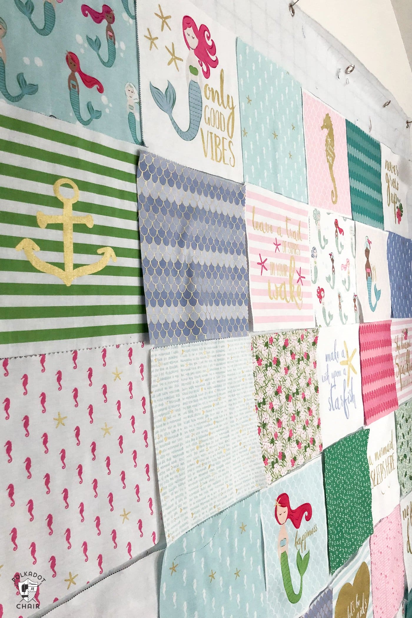 squares of fabric on design wall