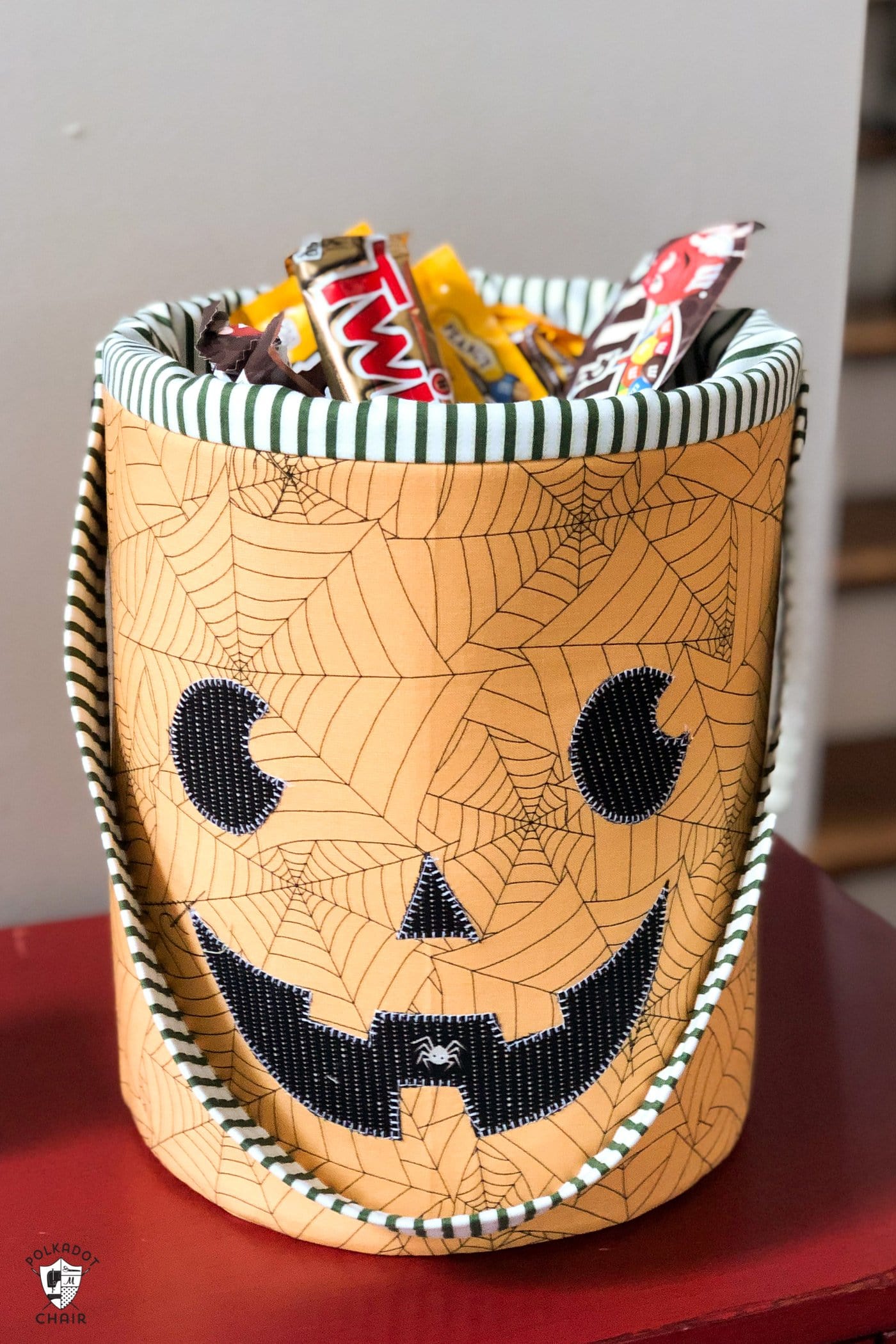 Orange fabric bin with pumpkin face