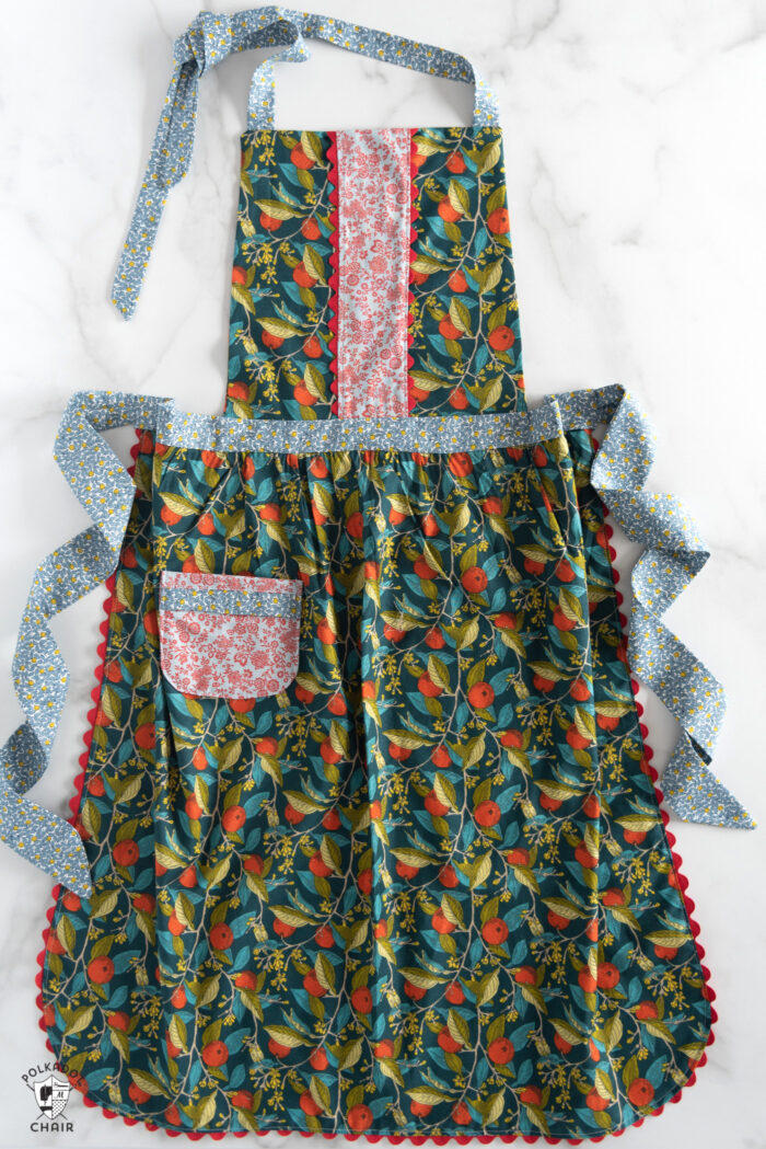 free apron sewing pattern from liberty london fabric on white table