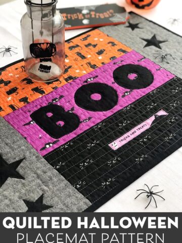 quilted halloween placemat on table with halloween decorations