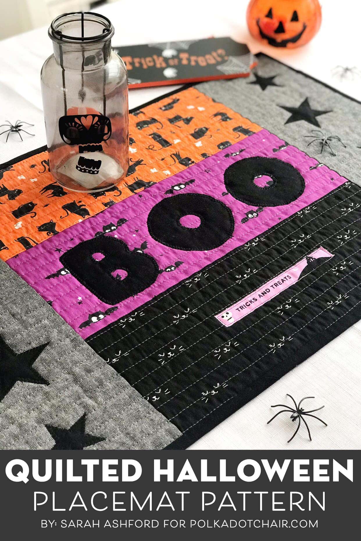 quilted halloween placemat on table with halloween decorations