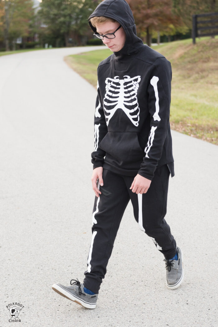 teen boy in skeleton costume