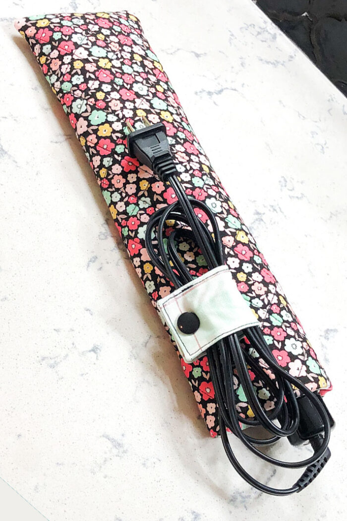 Travel Curling iron case on white countertop