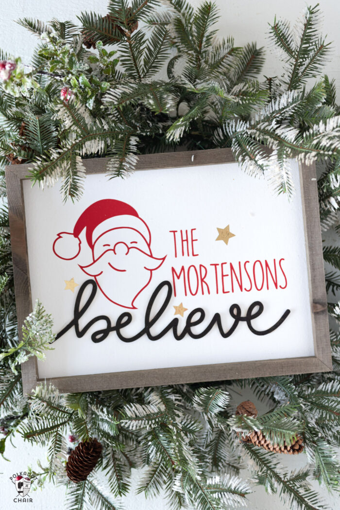 Believe Wood Christmas Sign on Christmas wreath