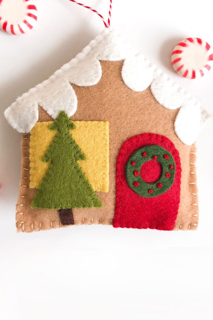 Felt Gingerbread house ornaments on white tabletop