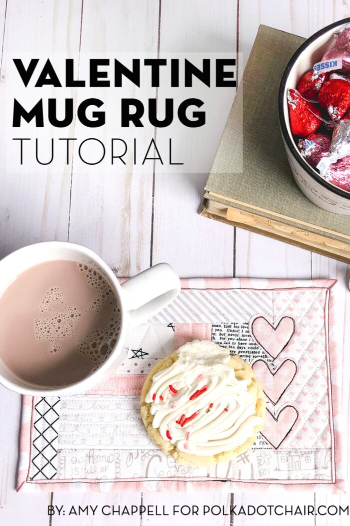 Valentine's Day mug rug on wood table with candy and cup of hot chocolate.