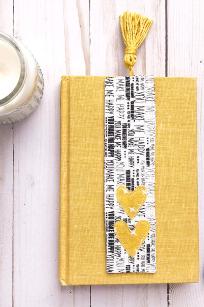 black and white fabric bookmark on yellow book