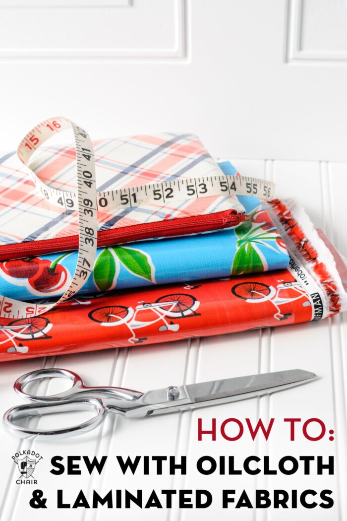 stack of laminated fabrics on white table with scissors