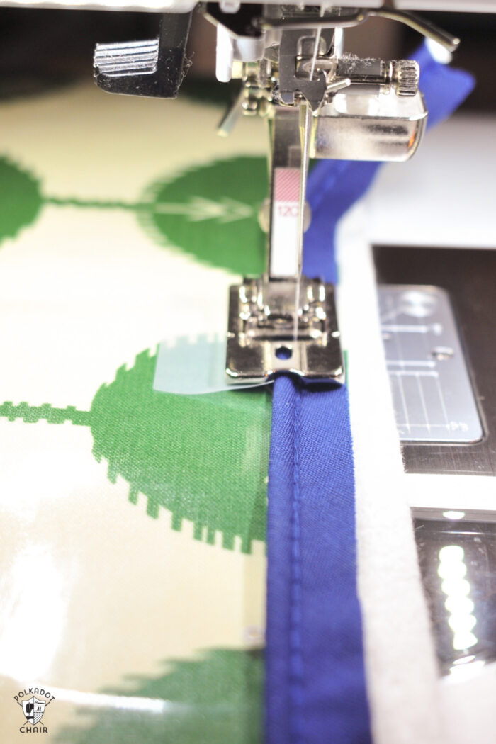 cording presser foot sewing on piping onto laminated green fabric