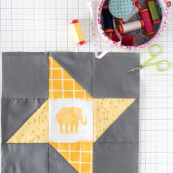 Friendship star quilt block on white cutting mat