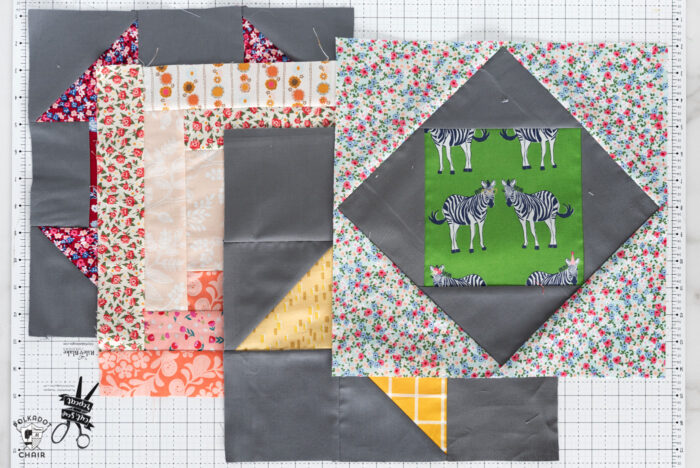 finished quilt blocks on white cutting mat