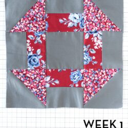 gray and red churn dash quilt block on white cutting mat